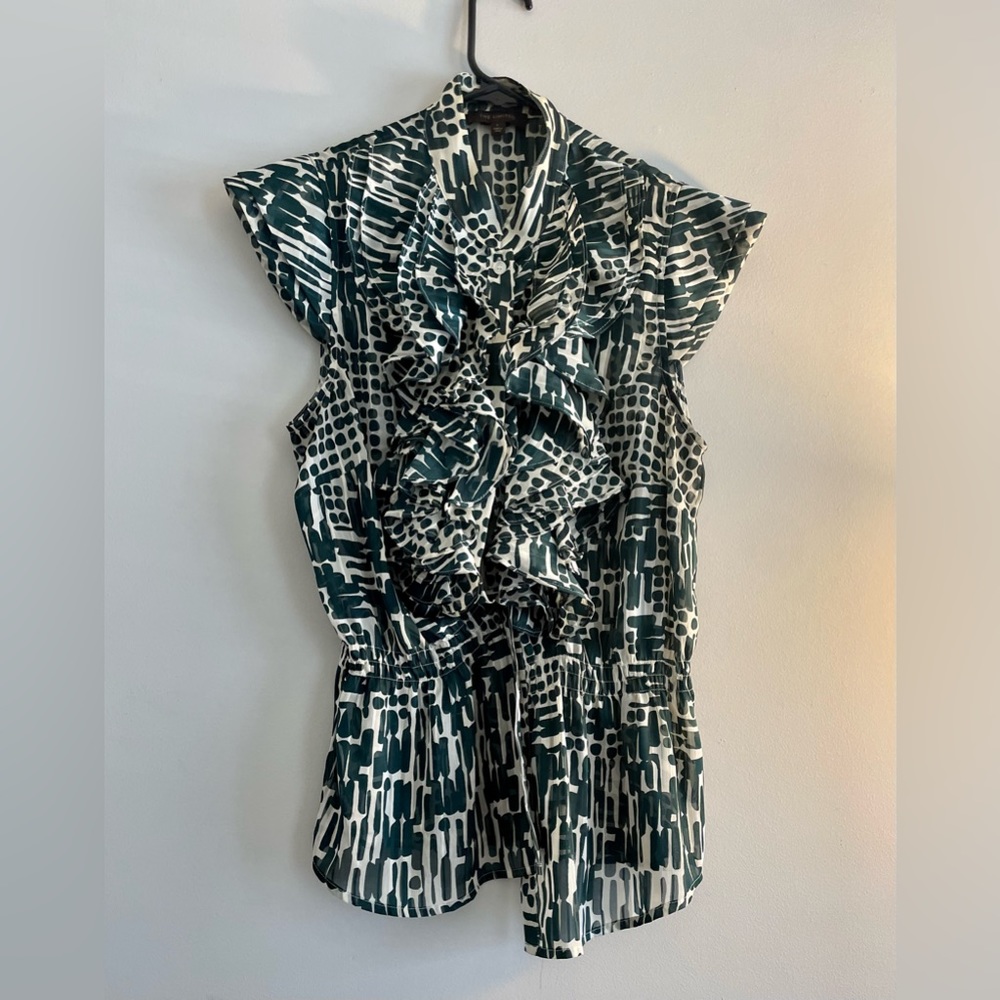 Green and white ruffle woman’s blouse